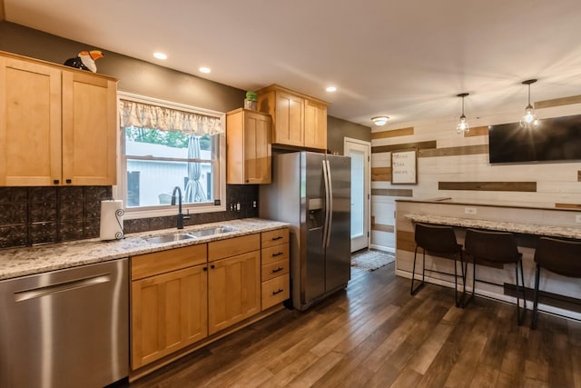 310 SE 3rd St, Panora, IA 50216 - kitchen featuring stainless steel appliances, dark wood-type flooring, tasteful backsplash, light brown cabinets, and light stone countertops