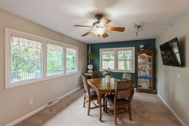 310 SE 3rd St, Panora, IA 50216 - dining space featuring healthy amount of natural light, a ceiling fan, and light carpet