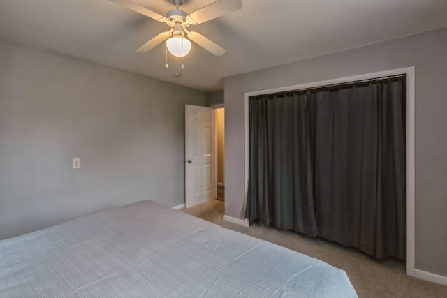 310 SE 3rd St, Panora, IA 50216 - carpeted bedroom featuring baseboards and a ceiling fan