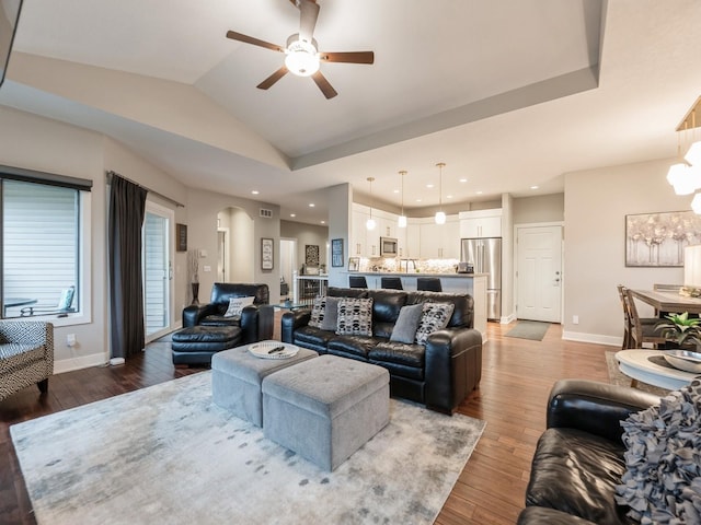 16530 Valleyview Ln, Clive, IA 50325 - living room with ceiling fan, light wood-style flooring, arched walkways, vaulted ceiling, and recessed lighting
