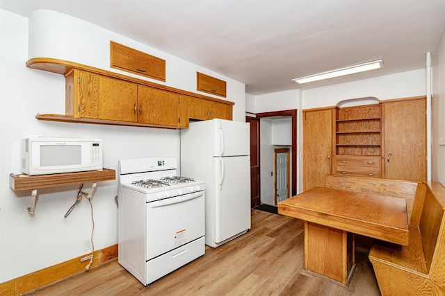 213 S Wilmoth Ave, Ames, IA 50014 - kitchen featuring white appliances, light wood finished floors, open shelves, and brown cabinets