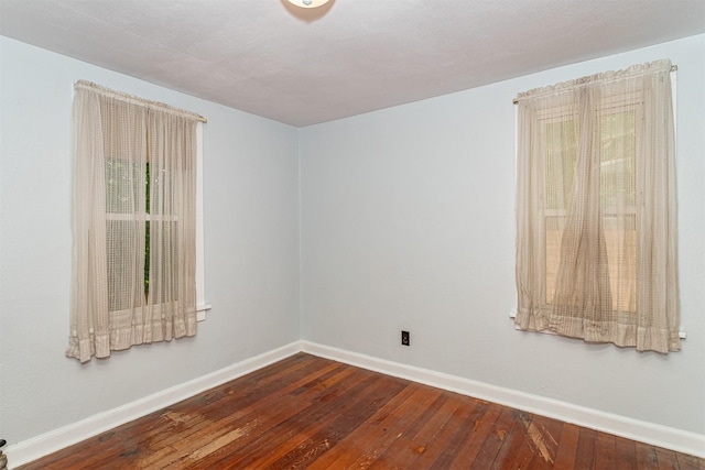 213 S Wilmoth Ave, Ames, IA 50014 - empty room featuring wood-type flooring and baseboards