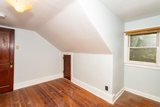 213 S Wilmoth Ave, Ames, IA 50014 - additional living space with hardwood / wood-style flooring and lofted ceiling