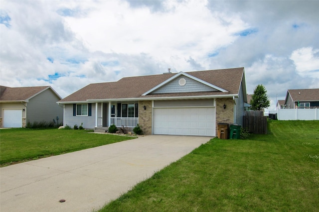 408 Tailfeather Ct NW, Bondurant, IA 50035 - ranch-style home featuring a garage, covered porch, concrete driveway, and brick siding