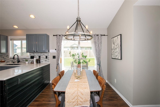 408 Tailfeather Ct NW, Bondurant, IA 50035 - dining area featuring a chandelier, dark wood-style floors, and recessed lighting
