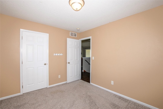 408 Tailfeather Ct NW, Bondurant, IA 50035 - unfurnished bedroom featuring light colored carpet and baseboards