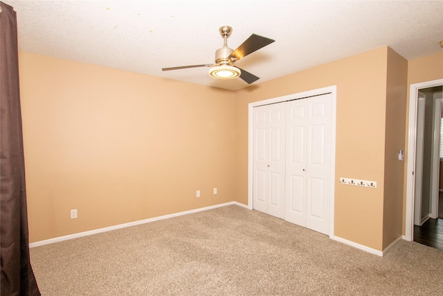 408 Tailfeather Ct NW, Bondurant, IA 50035 - unfurnished bedroom with carpet flooring, a closet, and a ceiling fan