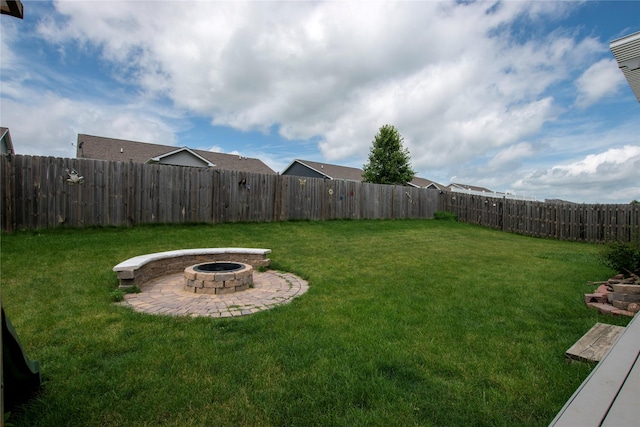 408 Tailfeather Ct NW, Bondurant, IA 50035 - fenced backyard with a fire pit and a patio