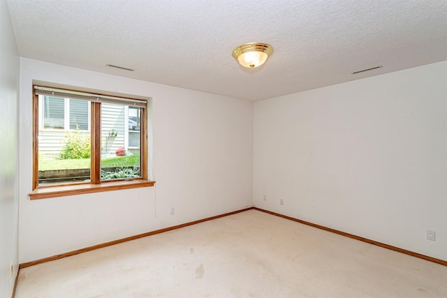 4012 Fletcher Blvd, Ames, IA 50010 - carpeted empty room with a textured ceiling and baseboards