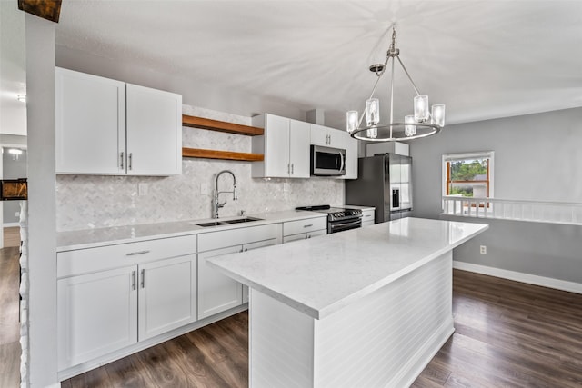 1115 E Herold Ave, Des Moines, IA 50315 - kitchen with appliances with stainless steel finishes, open shelves, dark wood-type flooring, backsplash, and white cabinetry