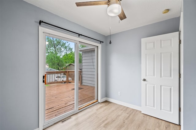 1115 E Herold Ave, Des Moines, IA 50315 - doorway to outside with ceiling fan and light wood finished floors