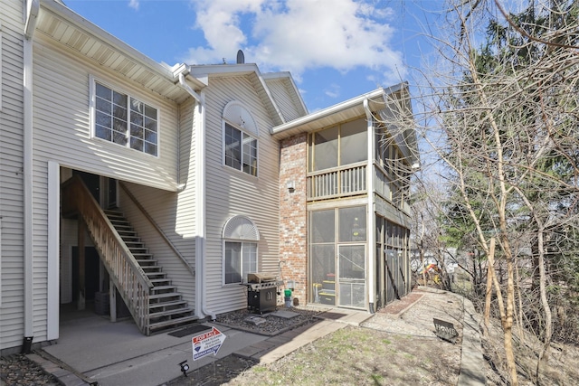 2547 Patricia Dr, Urbandale, IA 50322 - back of house featuring stairs