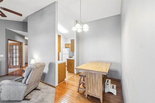 2547 Patricia Dr, Urbandale, IA 50322 - living area featuring a ceiling fan, light wood finished floors, and a chandelier