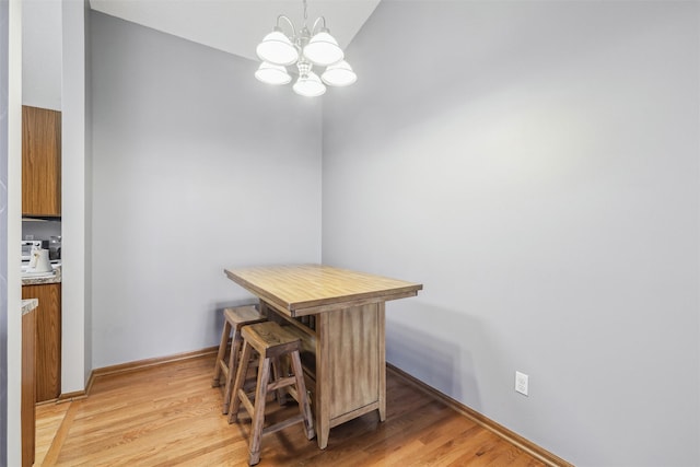 2547 Patricia Dr, Urbandale, IA 50322 - dining space with a chandelier and light wood-type flooring