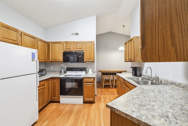 2547 Patricia Dr, Urbandale, IA 50322 - kitchen featuring white appliances, vaulted ceiling, light wood finished floors, light countertops, and brown cabinets