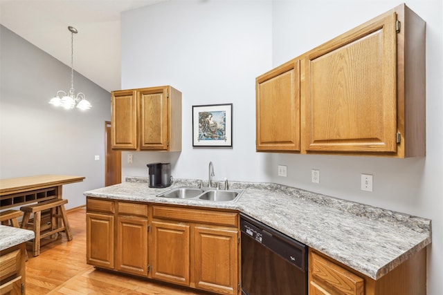 2547 Patricia Dr, Urbandale, IA 50322 - kitchen with dishwashing machine, light countertops, light wood-style flooring, hanging light fixtures, and a chandelier