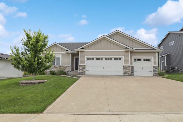 10214 Thorne Dr, West Des Moines, IA 50266 - craftsman-style house featuring board and batten siding, stone siding, a garage, driveway, and a front yard
