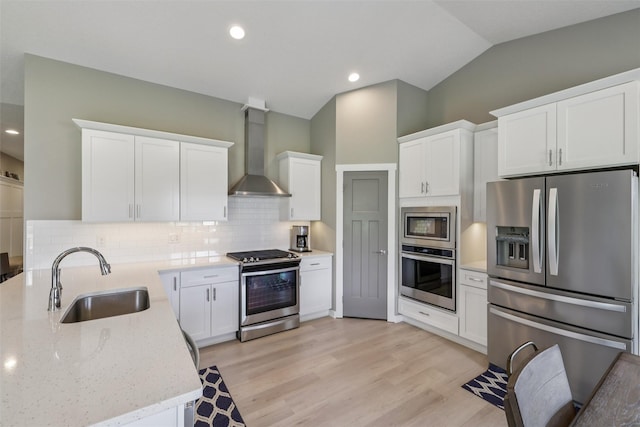 10214 Thorne Dr, West Des Moines, IA 50266 - kitchen with stainless steel appliances, wall chimney exhaust hood, tasteful backsplash, white cabinets, and recessed lighting