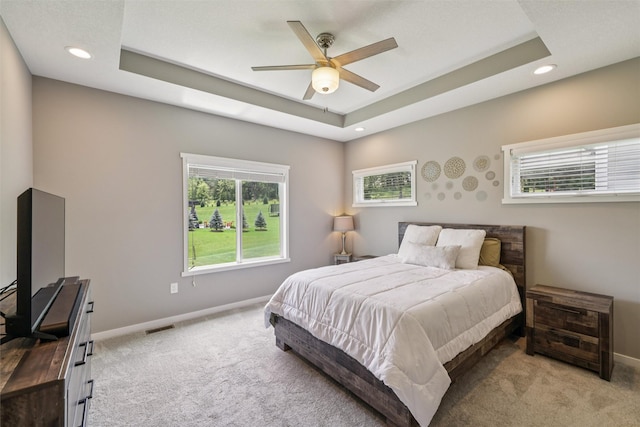 10214 Thorne Dr, West Des Moines, IA 50266 - carpeted bedroom with recessed lighting, a raised ceiling, and a ceiling fan
