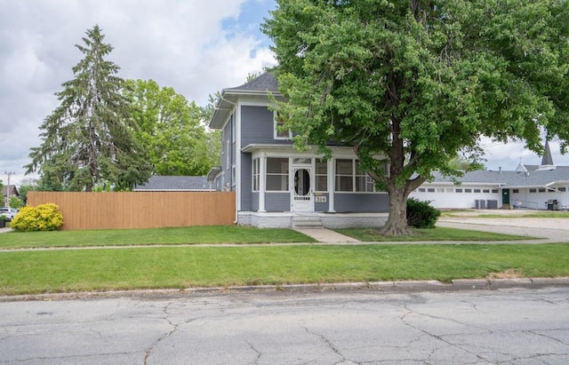 314 E 3rd St N, Newton, IA 50208 - view of front of property featuring concrete driveway and a sunroom