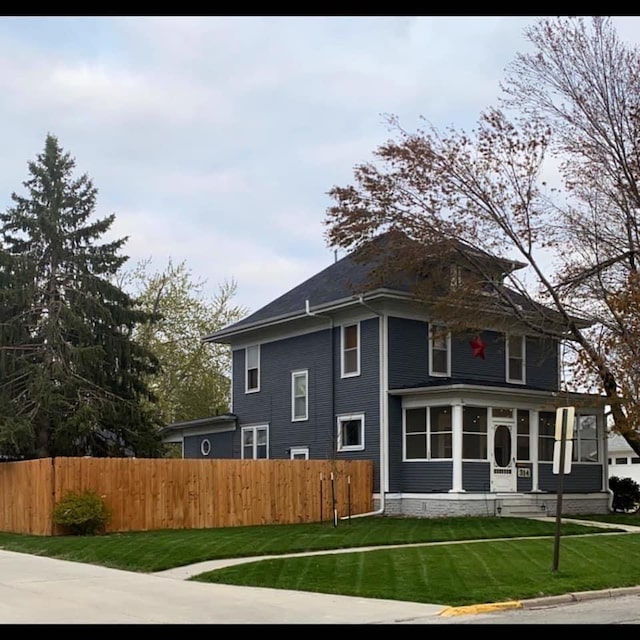 314 E 3rd St N, Newton, IA 50208 - back of house with a sunroom