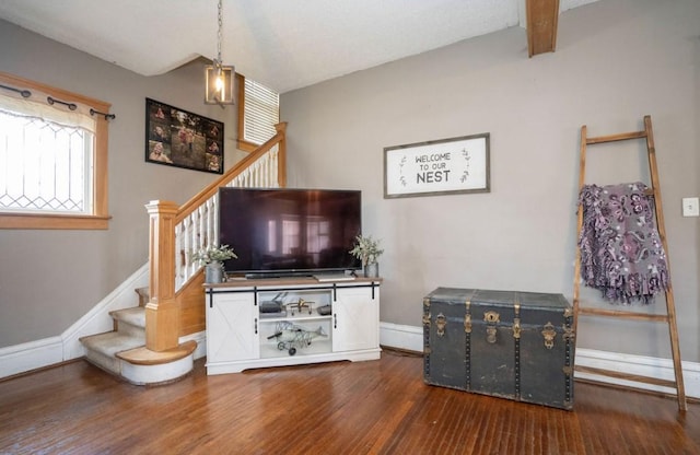 314 E 3rd St N, Newton, IA 50208 - living room with wood finished floors and stairway