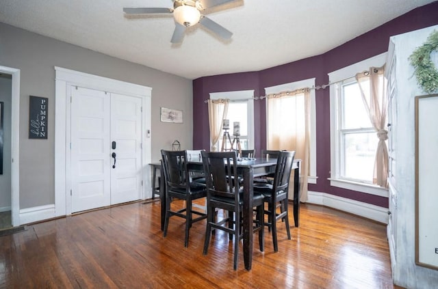314 E 3rd St N, Newton, IA 50208 - dining area with wood finished floors and a ceiling fan
