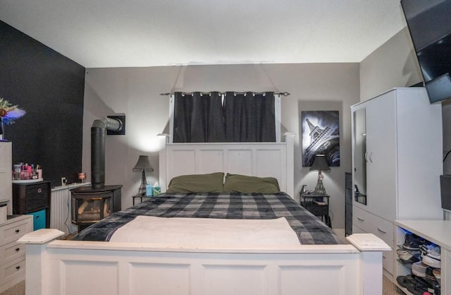 314 E 3rd St N, Newton, IA 50208 - bedroom with a wood stove