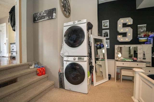 314 E 3rd St N, Newton, IA 50208 - washroom with estacked washer and dryer and light carpet
