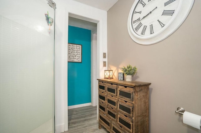 314 E 3rd St N, Newton, IA 50208 - hallway featuring wood finished floors and baseboards