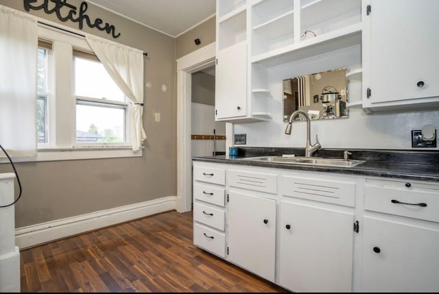 314 E 3rd St N, Newton, IA 50208 - kitchen featuring open shelves, dark countertops, and white cabinets