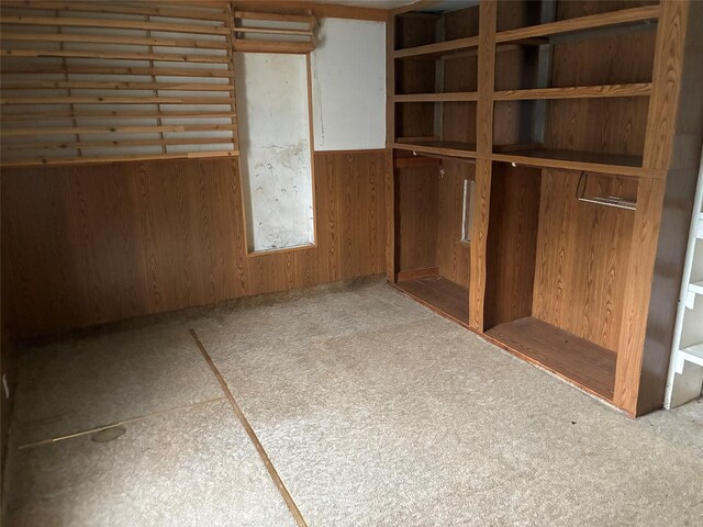 204 Missouri Ave, Lorimor, IA 50149 - unfurnished room featuring wood walls and wainscoting