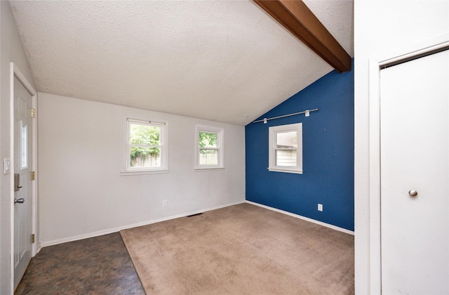 1144 57th St, Des Moines, IA 50311 - spare room with a textured ceiling and baseboards