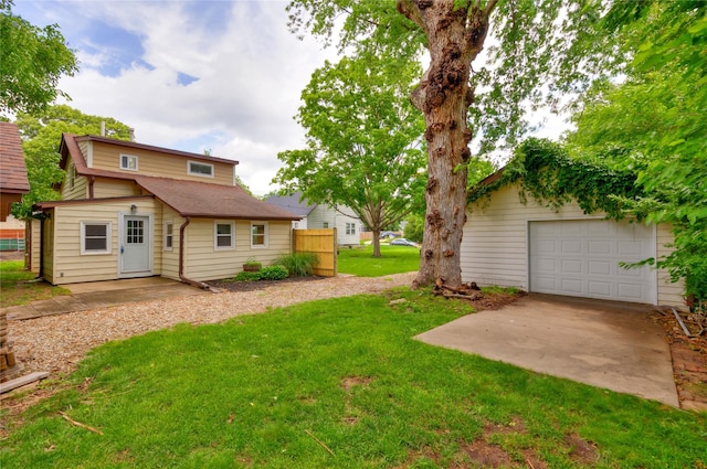 1144 57th St, Des Moines, IA 50311 - view of green lawn with concrete driveway