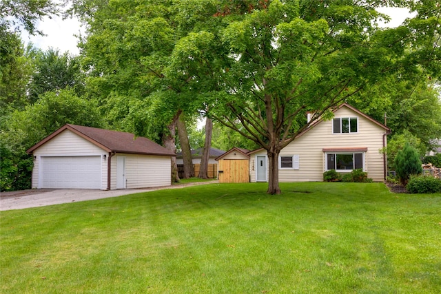 1144 57th St, Des Moines, IA 50311 - view of yard featuring an outbuilding and a detached garage