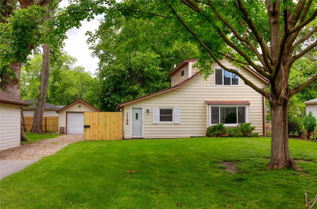 1144 57th St, Des Moines, IA 50311 - view of front facade featuring an outbuilding and a garage
