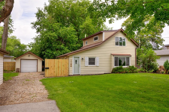 1144 57th St, Des Moines, IA 50311 - view of front facade featuring an outbuilding, a garage, and driveway