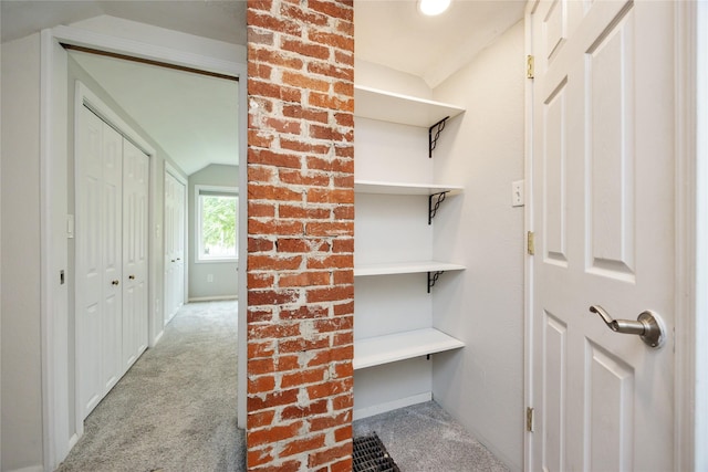 1144 57th St, Des Moines, IA 50311 - mudroom with vaulted ceiling and carpet