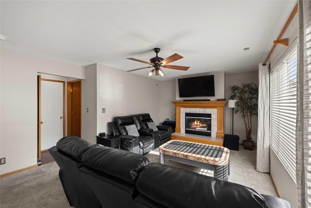 1215 7th Ave SE, Altoona, IA 50009 - carpeted living area with ceiling fan and a tile fireplace