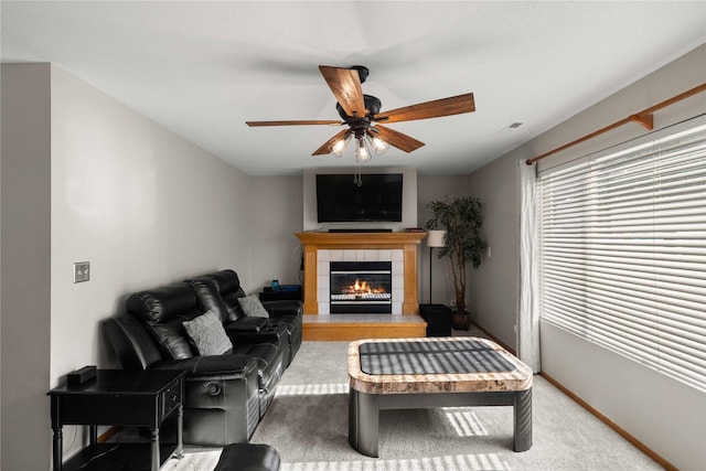 1215 7th Ave SE, Altoona, IA 50009 - carpeted living area featuring a ceiling fan and a tile fireplace