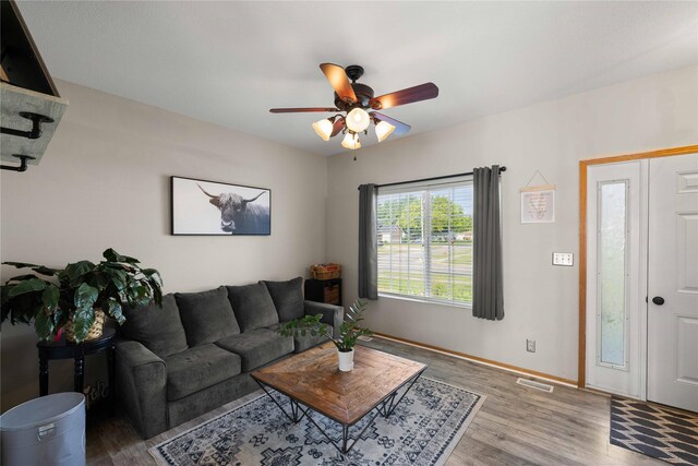 1215 7th Ave SE, Altoona, IA 50009 - living area with ceiling fan and wood finished floors