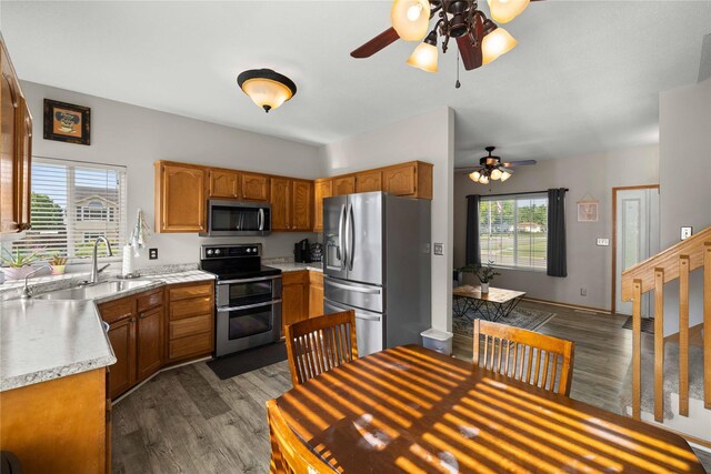 1215 7th Ave SE, Altoona, IA 50009 - kitchen featuring appliances with stainless steel finishes, ceiling fan, light countertops, and dark wood-style flooring