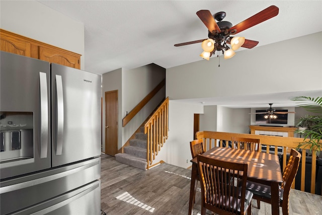 1215 7th Ave SE, Altoona, IA 50009 - dining space with a ceiling fan, light wood finished floors, and stairway