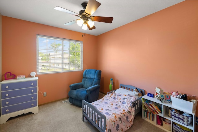 1215 7th Ave SE, Altoona, IA 50009 - carpeted bedroom with a ceiling fan and baseboards