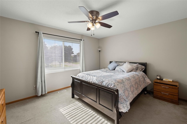 1215 7th Ave SE, Altoona, IA 50009 - bedroom with light colored carpet and a ceiling fan