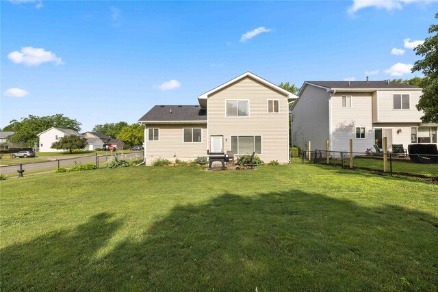 1215 7th Ave SE, Altoona, IA 50009 - rear view of property with a fenced backyard