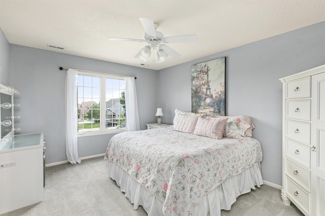 15222 Wilden Dr, Urbandale, IA 50323 - bedroom featuring light carpet and a ceiling fan