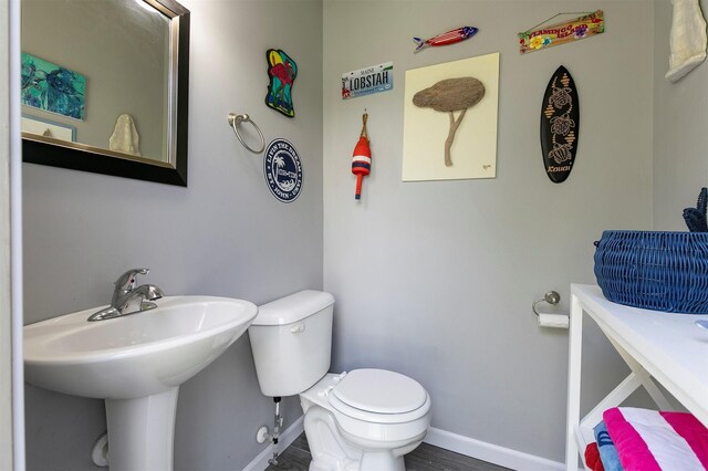 15222 Wilden Dr, Urbandale, IA 50323 - half bath with toilet and wood finished floors