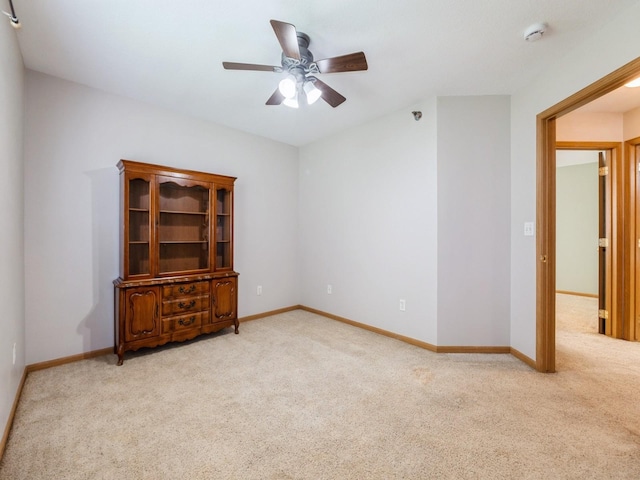 5908 Sutton Pl Unit 1, Urbandale, IA 50322 - unfurnished room featuring light carpet, a smoke detector, and a ceiling fan