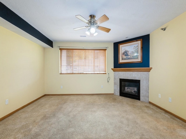 5908 Sutton Pl Unit 1, Urbandale, IA 50322 - unfurnished living room featuring carpet flooring, ceiling fan, and a tiled fireplace